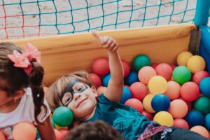 smiling child playing in an indoor playground